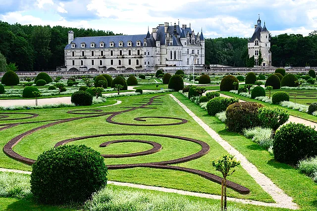 The parterre garden at Château de Chenonceau with the château in the distance