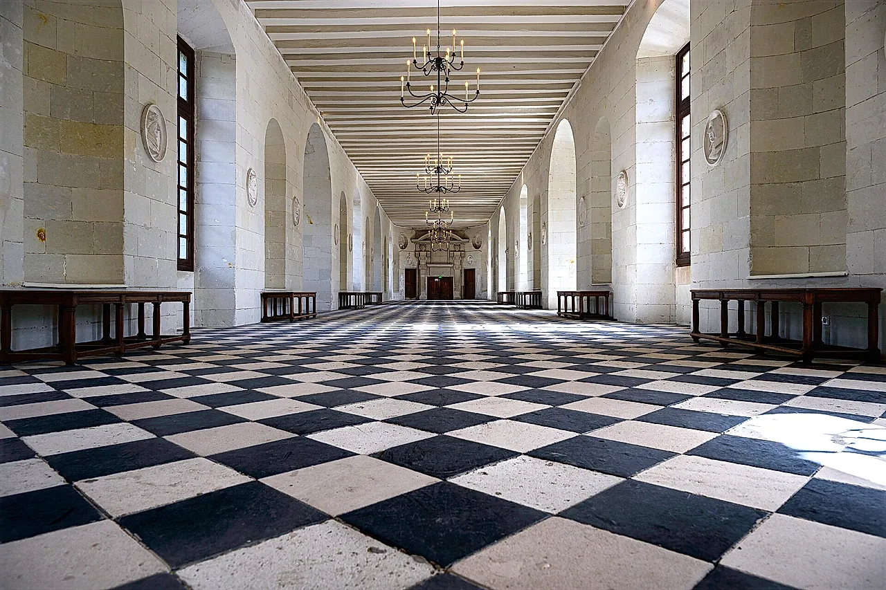 The black-and-white tiled floor of the long gallery inside Château de Chenonceau